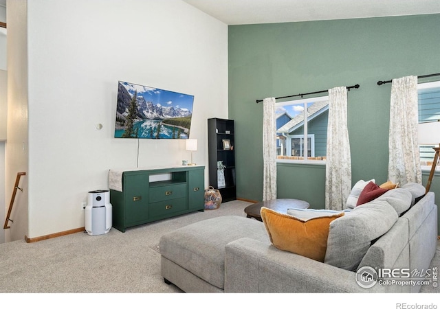 833 Kaitlyn Cir, Loveland, CO 80537 - carpeted living room featuring high vaulted ceiling and baseboards