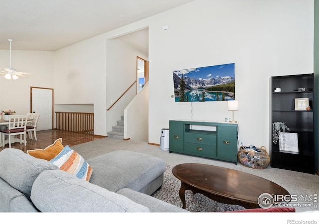 833 Kaitlyn Cir, Loveland, CO 80537 - living area featuring stairs, a ceiling fan, and high vaulted ceiling