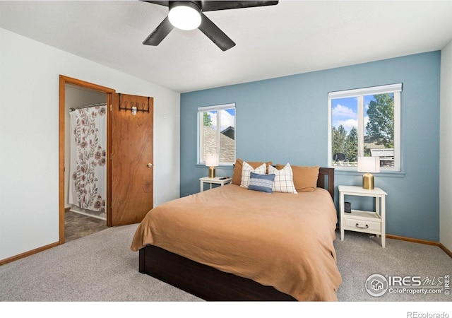833 Kaitlyn Cir, Loveland, CO 80537 - bedroom featuring carpet flooring, baseboards, ceiling fan, and ensuite bath