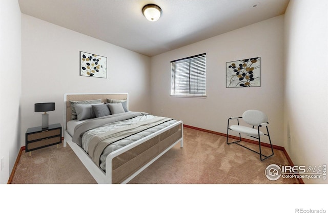 bedroom featuring carpet flooring and baseboards