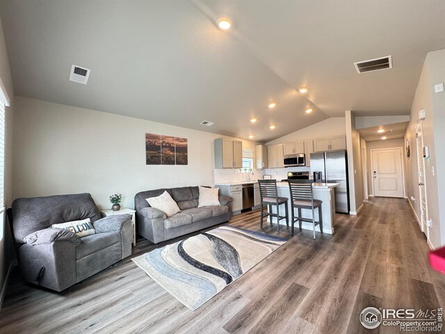 401 Bonneville Ave, Fort Lupton, CO 80621 - living area with dark wood finished floors and lofted ceiling
