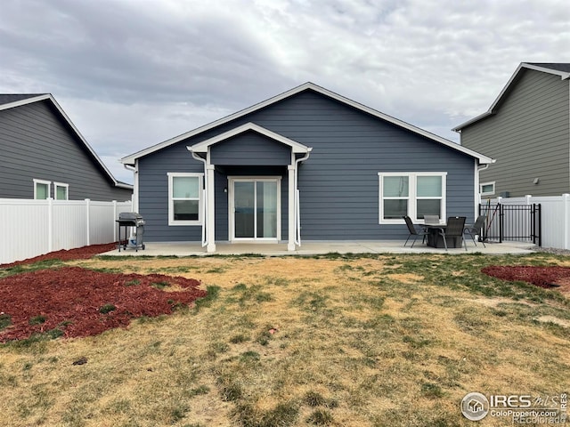 401 Bonneville Ave, Fort Lupton, CO 80621 - rear view of house with a patio