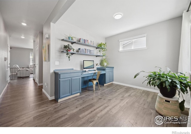 office space featuring wood finished floors, baseboards, healthy amount of natural light, and recessed lighting