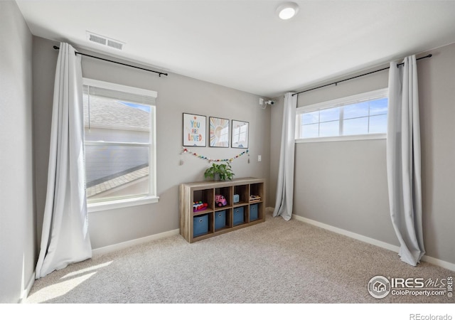 rec room with carpet flooring and baseboards