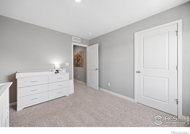 unfurnished bedroom featuring carpet floors and baseboards