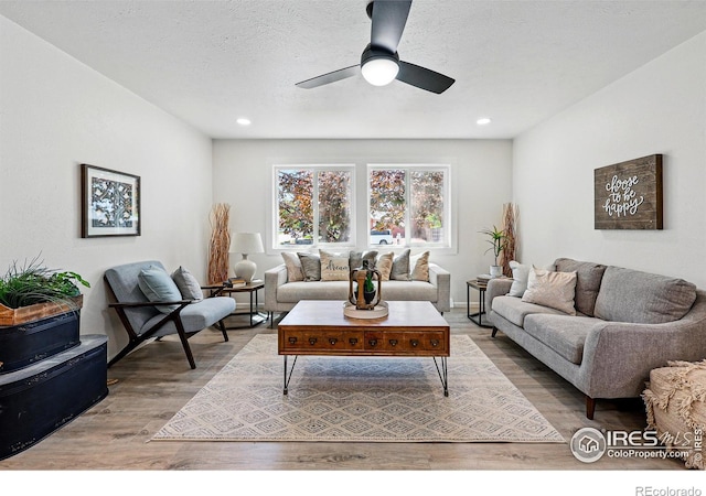 1805 W 22nd St, Loveland, CO 80538 - living room with wood finished floors, ceiling fan, and recessed lighting