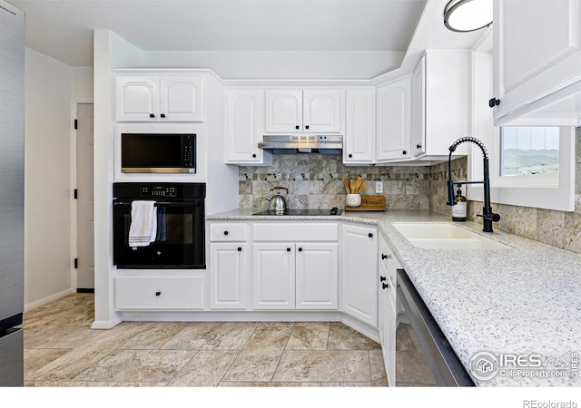 1805 W 22nd St, Loveland, CO 80538 - kitchen featuring black appliances, a sink, under cabinet range hood, backsplash, and white cabinetry