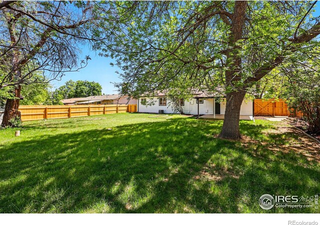 1805 W 22nd St, Loveland, CO 80538 - view of yard featuring a patio