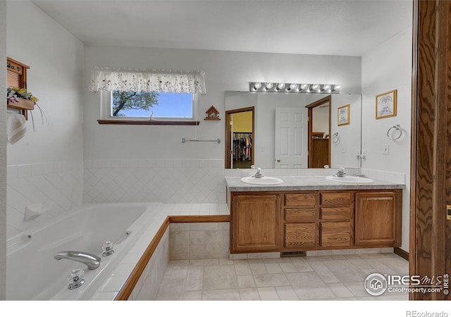 bathroom with a bath and double vanity