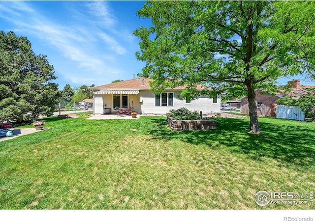 rear view of property featuring a patio