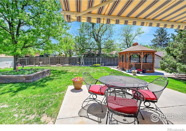 view of patio with a gazebo and outdoor dining area