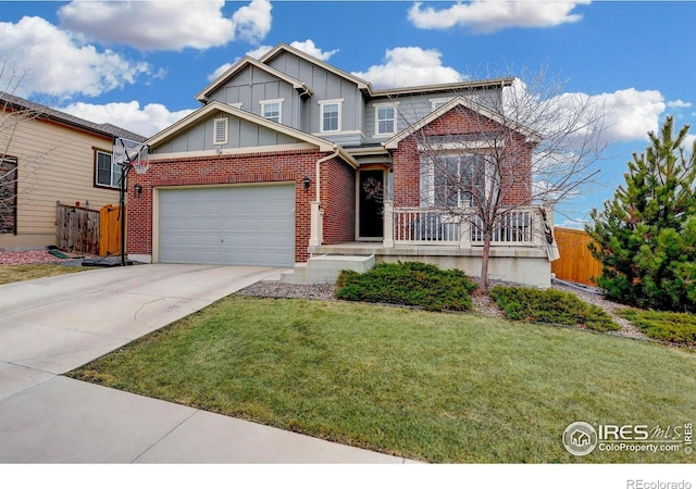 12917 Fox St, Broomfield, CO 80020 - view of front of property with board and batten siding, driveway, an attached garage, brick siding, and a porch