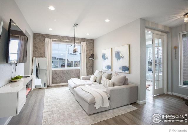 12917 Fox St, Broomfield, CO 80020 - living area featuring wood finished floors, recessed lighting, and baseboards