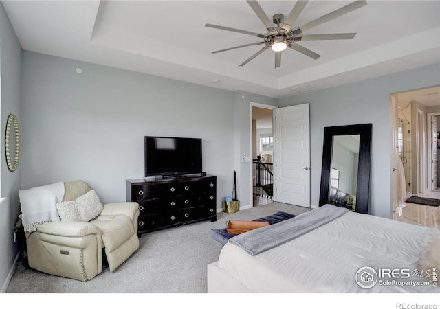 12917 Fox St, Broomfield, CO 80020 - carpeted bedroom with a raised ceiling, baseboards, and ceiling fan