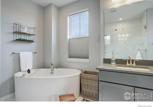 12917 Fox St, Broomfield, CO 80020 - full bathroom featuring vanity, a soaking tub, and tiled shower