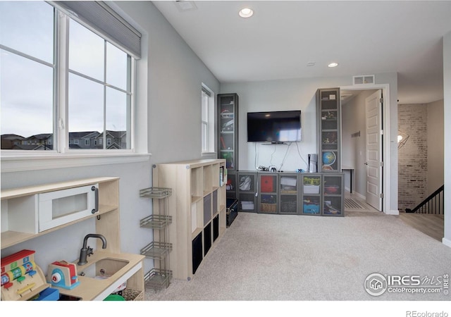 12917 Fox St, Broomfield, CO 80020 - playroom featuring a sink, carpet floors, and recessed lighting