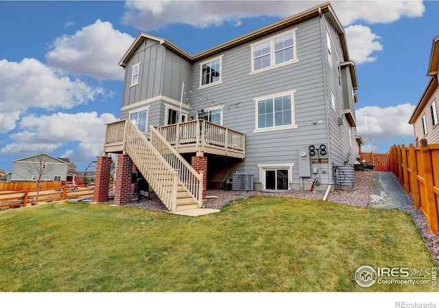 12917 Fox St, Broomfield, CO 80020 - rear view of property featuring board and batten siding, a wooden deck, stairway, and central AC unit