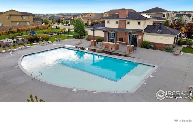 12917 Fox St, Broomfield, CO 80020 - community pool with a residential view, a patio area, a pergola, and fence