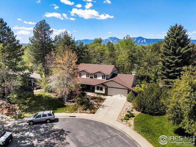 4311 Pali Way, Boulder, CO 80301 - aerial view of property and surrounding area with a heavily wooded area and a mountainous background