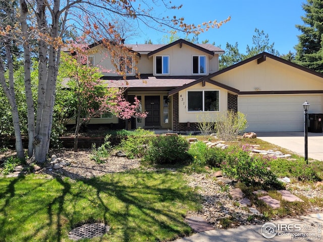 4311 Pali Way, Boulder, CO 80301 - traditional home with a garage, concrete driveway, a shingled roof, brick siding, and a front yard