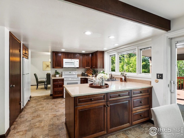 4311 Pali Way, Boulder, CO 80301 - kitchen with white appliances, stone finish flooring, light countertops, healthy amount of natural light, and recessed lighting
