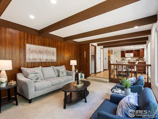 4311 Pali Way, Boulder, CO 80301 - living area with wooden walls, light carpet, beamed ceiling, and recessed lighting