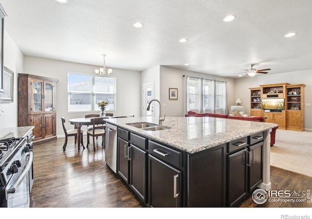 1471 Sabin Ct, Berthoud, CO 80513 - kitchen featuring stainless steel appliances, a sink, a chandelier, ceiling fan, and dark wood-style flooring