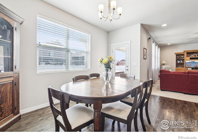 1471 Sabin Ct, Berthoud, CO 80513 - dining room with wood finished floors, a chandelier, baseboards, and recessed lighting