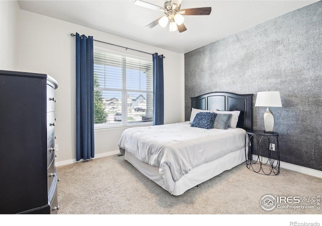 1471 Sabin Ct, Berthoud, CO 80513 - bedroom featuring carpet floors, baseboards, an accent wall, and ceiling fan