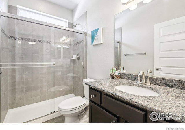 1471 Sabin Ct, Berthoud, CO 80513 - bathroom with toilet, a stall shower, and vanity