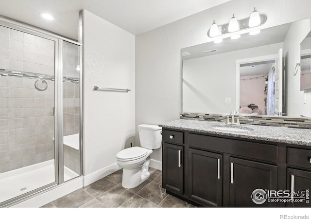 1471 Sabin Ct, Berthoud, CO 80513 - ensuite bathroom featuring a shower stall, vanity, and toilet
