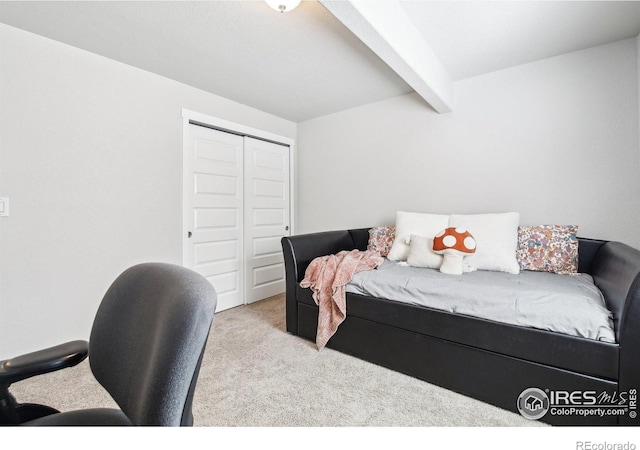 1471 Sabin Ct, Berthoud, CO 80513 - carpeted bedroom with beamed ceiling and a closet