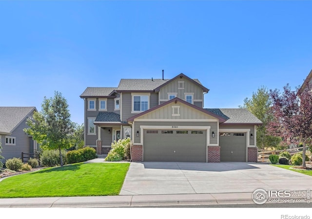 8265 Blackwood Dr, Windsor, CO 80550 - craftsman-style home with a garage, a front yard, board and batten siding, concrete driveway, and brick siding