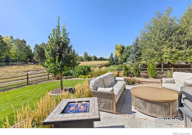 8265 Blackwood Dr, Windsor, CO 80550 - view of patio / terrace with an outdoor living space with a fire pit and a rural view
