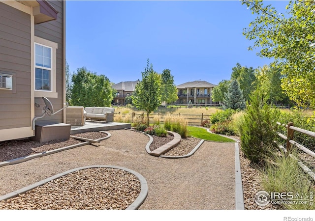 8265 Blackwood Dr, Windsor, CO 80550 - view of yard with an outdoor hangout area, a patio, and fence