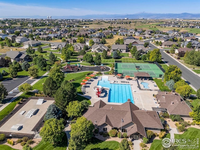 8265 Blackwood Dr, Windsor, CO 80550 - aerial view of residential area featuring a pool and mountains