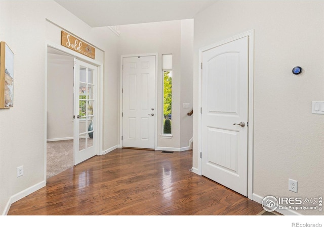 8265 Blackwood Dr, Windsor, CO 80550 - foyer entrance featuring wood finished floors, baseboards, and french doors