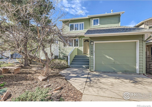 1149 Quince Ave, Boulder, CO 80304 - view of front of property with driveway, a shingled roof, and a garage