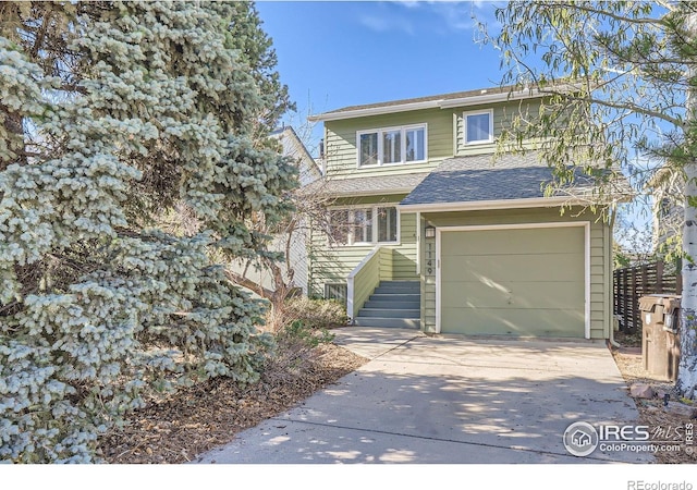 1149 Quince Ave, Boulder, CO 80304 - traditional home featuring driveway, an attached garage, and roof with shingles