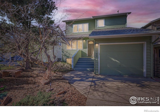 1149 Quince Ave, Boulder, CO 80304 - view of front of home with driveway, a garage, and a shingled roof
