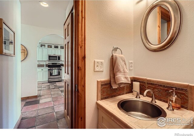 1149 Quince Ave, Boulder, CO 80304 - bathroom with vanity and tasteful backsplash