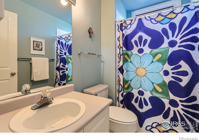 1149 Quince Ave, Boulder, CO 80304 - bathroom featuring toilet, vanity, and a shower with shower curtain