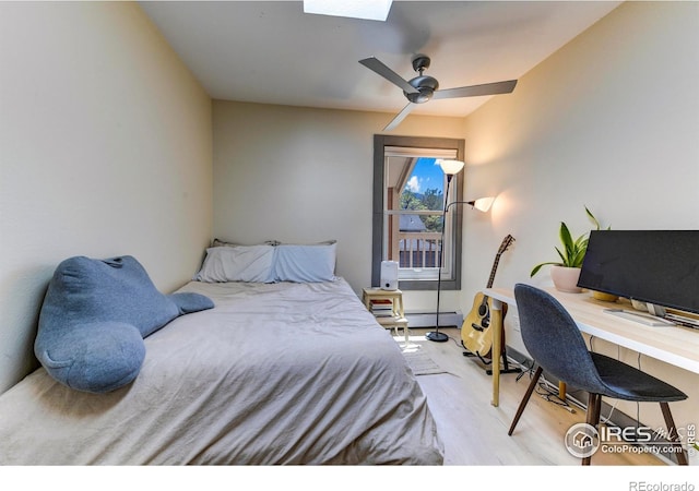 3025 Broadway St Unit 10, Boulder, CO 80304 - bedroom featuring a baseboard heating unit, light wood-type flooring, an office area, and ceiling fan