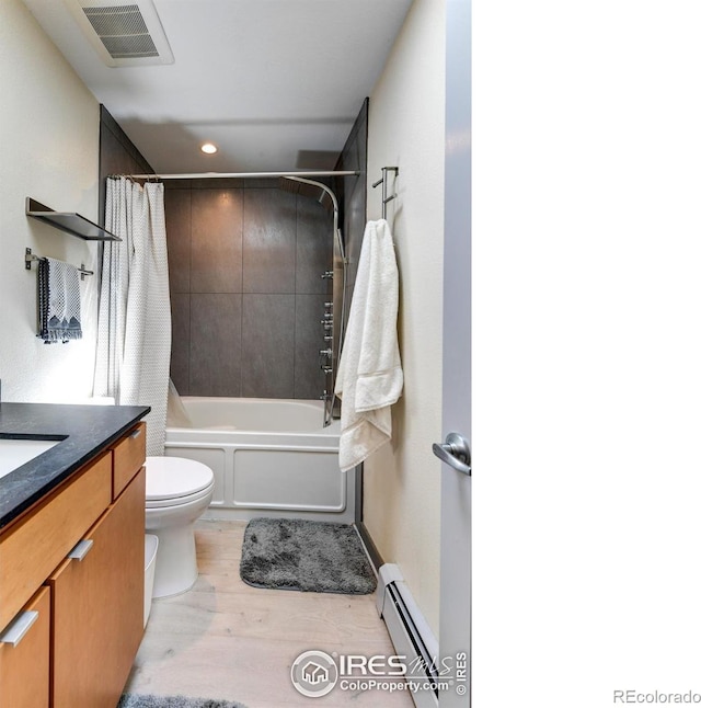 3025 Broadway St Unit 10, Boulder, CO 80304 - full bathroom with a baseboard heating unit, wood finished floors, recessed lighting, toilet, and shower / tub combo