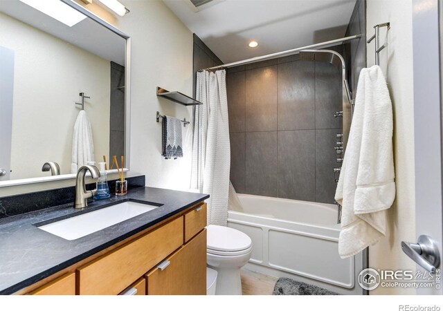 3025 Broadway St Unit 10, Boulder, CO 80304 - full bathroom with toilet, recessed lighting, shower / bath combo with shower curtain, and vanity