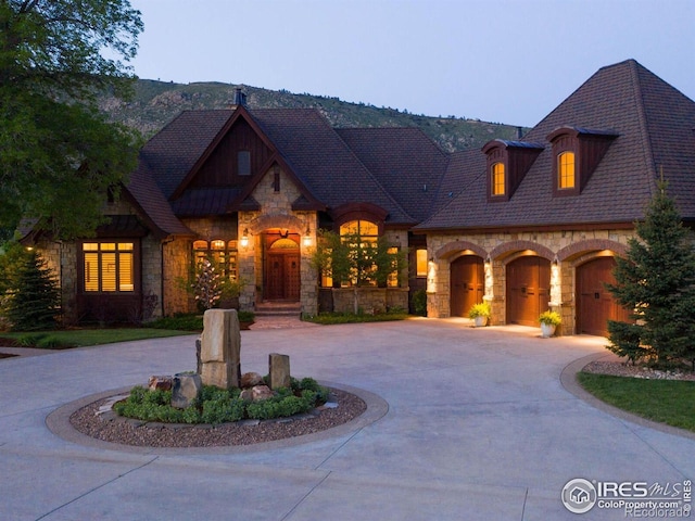 9840 Buckhorn Rd, Loveland, CO 80538 - view of front of home featuring stone siding and curved driveway