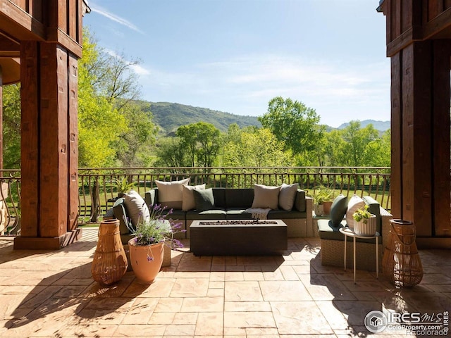 9840 Buckhorn Rd, Loveland, CO 80538 - view of patio with outdoor lounge area, a mountain view, and a wooded view
