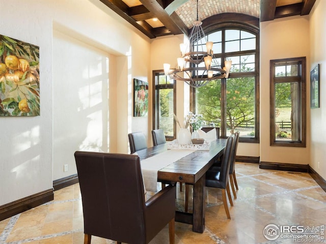 9840 Buckhorn Rd, Loveland, CO 80538 - dining space with plenty of natural light, baseboards, a chandelier, beamed ceiling, and a high ceiling