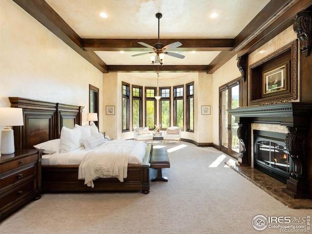 9840 Buckhorn Rd, Loveland, CO 80538 - bedroom featuring light colored carpet, beam ceiling, baseboards, a fireplace, and recessed lighting