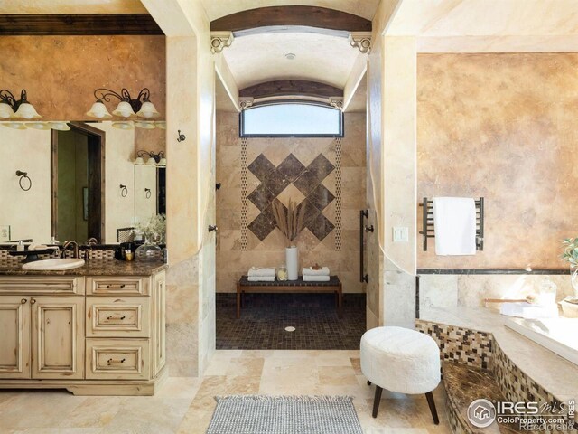 9840 Buckhorn Rd, Loveland, CO 80538 - bathroom with a tile shower, vanity, and vaulted ceiling